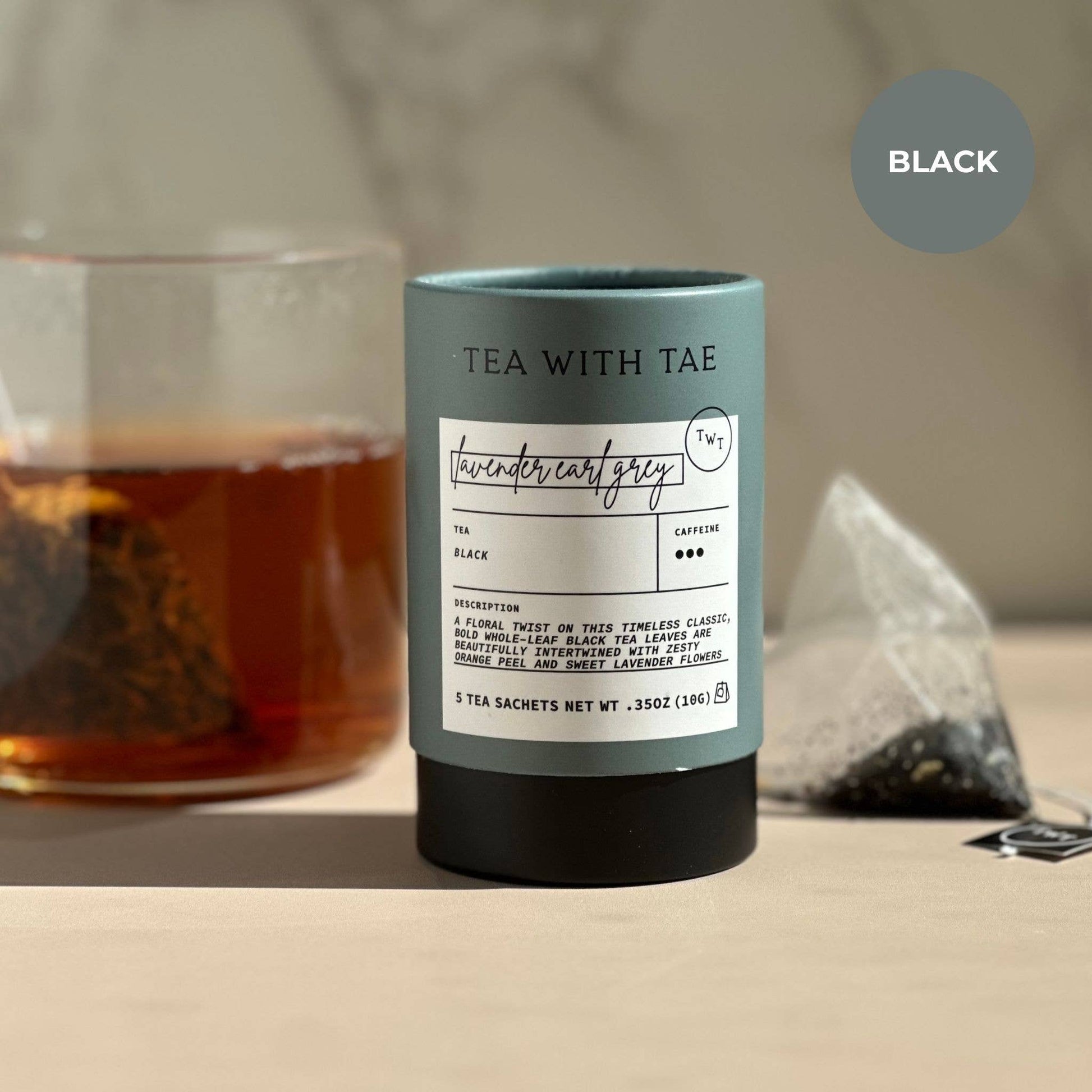 Tea canister with label and tea bag on a blurred background